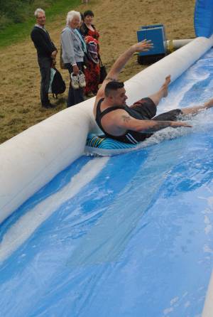 Ilminster Town FC fun day Part 3 – July 9, 2016: A giant water slide was the star attraction at a family fun day held to celebrate Ilminster Town Football Club’s new Archie Gooch Pavilion headquarters in Britten’s Field. Photo 29