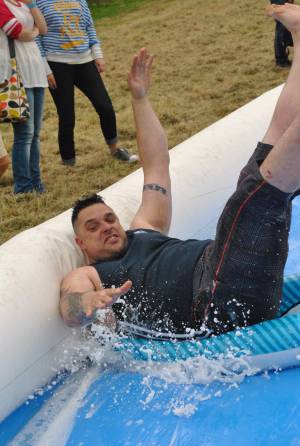 Ilminster Town FC fun day Part 3 – July 9, 2016: A giant water slide was the star attraction at a family fun day held to celebrate Ilminster Town Football Club’s new Archie Gooch Pavilion headquarters in Britten’s Field. Photo 30