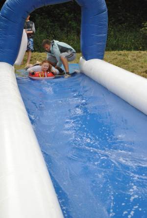 Ilminster Town FC fun day Part 3 – July 9, 2016: A giant water slide was the star attraction at a family fun day held to celebrate Ilminster Town Football Club’s new Archie Gooch Pavilion headquarters in Britten’s Field. Photo 8