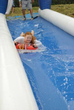 Ilminster Town FC fun day Part 3 – July 9, 2016: A giant water slide was the star attraction at a family fun day held to celebrate Ilminster Town Football Club’s new Archie Gooch Pavilion headquarters in Britten’s Field. Photo 9