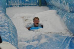 Ilminster Town FC fun day Part 4 – July 9, 2016: A giant water slide was the star attraction at a family fun day held to celebrate Ilminster Town Football Club’s new Archie Gooch Pavilion headquarters in Britten’s Field. Photo 11