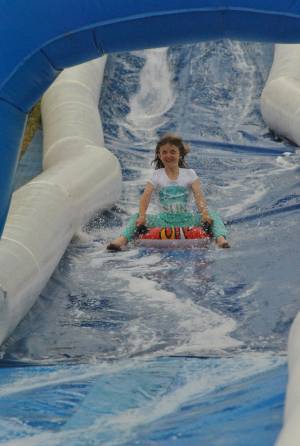 Ilminster Town FC fun day Part 4 – July 9, 2016: A giant water slide was the star attraction at a family fun day held to celebrate Ilminster Town Football Club’s new Archie Gooch Pavilion headquarters in Britten’s Field. Photo 12