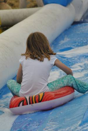 Ilminster Town FC fun day Part 4 – July 9, 2016: A giant water slide was the star attraction at a family fun day held to celebrate Ilminster Town Football Club’s new Archie Gooch Pavilion headquarters in Britten’s Field. Photo 13