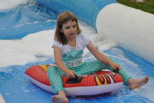 Ilminster Town FC fun day Part 4 – July 9, 2016: A giant water slide was the star attraction at a family fun day held to celebrate Ilminster Town Football Club’s new Archie Gooch Pavilion headquarters in Britten’s Field. Photo 14