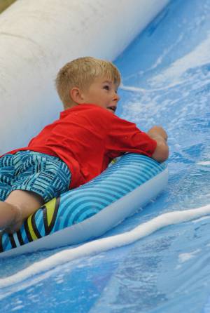 Ilminster Town FC fun day Part 4 – July 9, 2016: A giant water slide was the star attraction at a family fun day held to celebrate Ilminster Town Football Club’s new Archie Gooch Pavilion headquarters in Britten’s Field. Photo 15