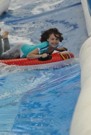 Ilminster Town FC fun day Part 4 – July 9, 2016: A giant water slide was the star attraction at a family fun day held to celebrate Ilminster Town Football Club’s new Archie Gooch Pavilion headquarters in Britten’s Field. Photo 16