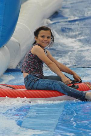 Ilminster Town FC fun day Part 4 – July 9, 2016: A giant water slide was the star attraction at a family fun day held to celebrate Ilminster Town Football Club’s new Archie Gooch Pavilion headquarters in Britten’s Field. Photo 21