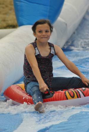 Ilminster Town FC fun day Part 4 – July 9, 2016: A giant water slide was the star attraction at a family fun day held to celebrate Ilminster Town Football Club’s new Archie Gooch Pavilion headquarters in Britten’s Field. Photo 22