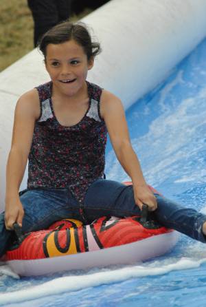 Ilminster Town FC fun day Part 4 – July 9, 2016: A giant water slide was the star attraction at a family fun day held to celebrate Ilminster Town Football Club’s new Archie Gooch Pavilion headquarters in Britten’s Field. Photo 23