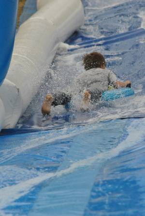 Ilminster Town FC fun day Part 4 – July 9, 2016: A giant water slide was the star attraction at a family fun day held to celebrate Ilminster Town Football Club’s new Archie Gooch Pavilion headquarters in Britten’s Field. Photo 24