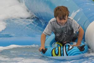 Ilminster Town FC fun day Part 4 – July 9, 2016: A giant water slide was the star attraction at a family fun day held to celebrate Ilminster Town Football Club’s new Archie Gooch Pavilion headquarters in Britten’s Field. Photo 26