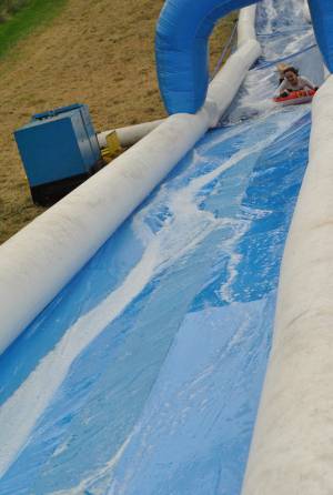 Ilminster Town FC fun day Part 4 – July 9, 2016: A giant water slide was the star attraction at a family fun day held to celebrate Ilminster Town Football Club’s new Archie Gooch Pavilion headquarters in Britten’s Field. Photo 2