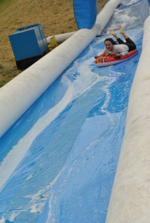 Ilminster Town FC fun day Part 4 – July 9, 2016: A giant water slide was the star attraction at a family fun day held to celebrate Ilminster Town Football Club’s new Archie Gooch Pavilion headquarters in Britten’s Field. Photo 3