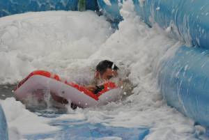 Ilminster Town FC fun day Part 5 – July 9, 2016: A giant water slide was the star attraction at a family fun day held to celebrate Ilminster Town Football Club’s new Archie Gooch Pavilion headquarters in Britten’s Field. Photo 12