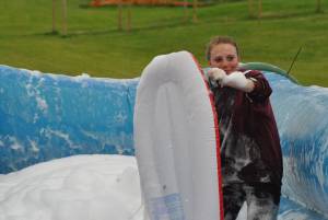 Ilminster Town FC fun day Part 5 – July 9, 2016: A giant water slide was the star attraction at a family fun day held to celebrate Ilminster Town Football Club’s new Archie Gooch Pavilion headquarters in Britten’s Field. Photo 1