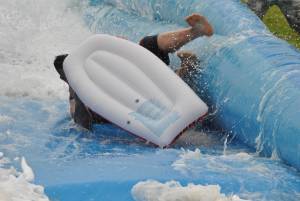Ilminster Town FC fun day Part 5 – July 9, 2016: A giant water slide was the star attraction at a family fun day held to celebrate Ilminster Town Football Club’s new Archie Gooch Pavilion headquarters in Britten’s Field. Photo 19