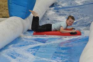 Ilminster Town FC fun day Part 5 – July 9, 2016: A giant water slide was the star attraction at a family fun day held to celebrate Ilminster Town Football Club’s new Archie Gooch Pavilion headquarters in Britten’s Field. Photo 2