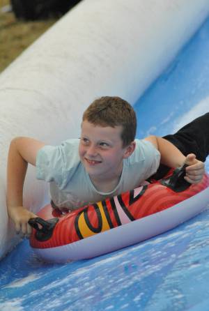 Ilminster Town FC fun day Part 5 – July 9, 2016: A giant water slide was the star attraction at a family fun day held to celebrate Ilminster Town Football Club’s new Archie Gooch Pavilion headquarters in Britten’s Field. Photo 3