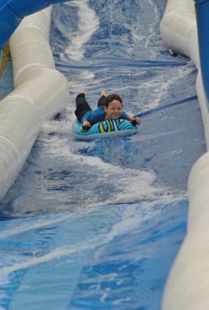 Ilminster Town FC fun day Part 5 – July 9, 2016: A giant water slide was the star attraction at a family fun day held to celebrate Ilminster Town Football Club’s new Archie Gooch Pavilion headquarters in Britten’s Field. Photo 4