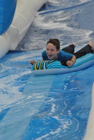 Ilminster Town FC fun day Part 5 – July 9, 2016: A giant water slide was the star attraction at a family fun day held to celebrate Ilminster Town Football Club’s new Archie Gooch Pavilion headquarters in Britten’s Field. Photo 5
