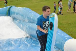 Ilminster Town FC fun day Part 5 – July 9, 2016: A giant water slide was the star attraction at a family fun day held to celebrate Ilminster Town Football Club’s new Archie Gooch Pavilion headquarters in Britten’s Field. Photo 7