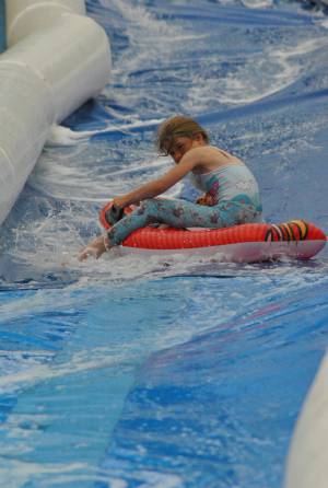 Ilminster Town FC fun day Part 6 – July 9, 2016: A giant water slide was the star attraction at a family fun day held to celebrate Ilminster Town Football Club’s new Archie Gooch Pavilion headquarters in Britten’s Field. Photo 10