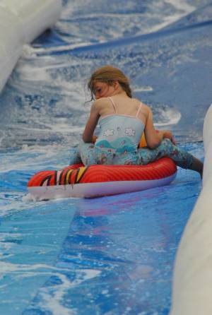 Ilminster Town FC fun day Part 6 – July 9, 2016: A giant water slide was the star attraction at a family fun day held to celebrate Ilminster Town Football Club’s new Archie Gooch Pavilion headquarters in Britten’s Field. Photo 11