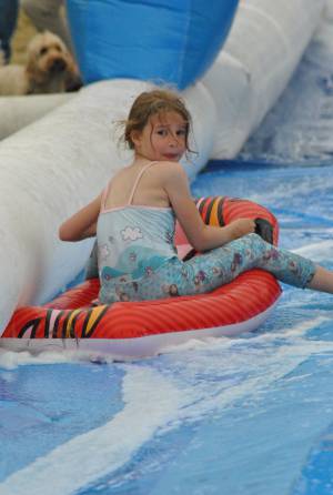 Ilminster Town FC fun day Part 6 – July 9, 2016: A giant water slide was the star attraction at a family fun day held to celebrate Ilminster Town Football Club’s new Archie Gooch Pavilion headquarters in Britten’s Field. Photo 12