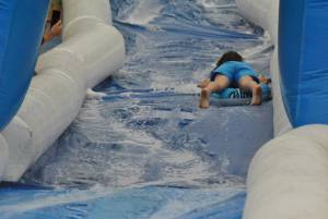 Ilminster Town FC fun day Part 6 – July 9, 2016: A giant water slide was the star attraction at a family fun day held to celebrate Ilminster Town Football Club’s new Archie Gooch Pavilion headquarters in Britten’s Field. Photo 13