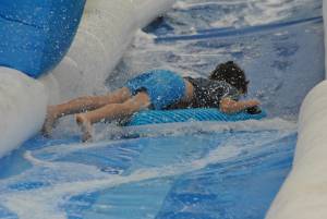 Ilminster Town FC fun day Part 6 – July 9, 2016: A giant water slide was the star attraction at a family fun day held to celebrate Ilminster Town Football Club’s new Archie Gooch Pavilion headquarters in Britten’s Field. Photo 14