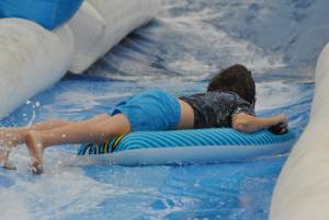 Ilminster Town FC fun day Part 6 – July 9, 2016: A giant water slide was the star attraction at a family fun day held to celebrate Ilminster Town Football Club’s new Archie Gooch Pavilion headquarters in Britten’s Field. Photo 15