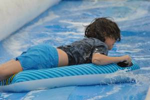 Ilminster Town FC fun day Part 6 – July 9, 2016: A giant water slide was the star attraction at a family fun day held to celebrate Ilminster Town Football Club’s new Archie Gooch Pavilion headquarters in Britten’s Field. Photo 16
