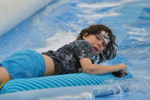 Ilminster Town FC fun day Part 6 – July 9, 2016: A giant water slide was the star attraction at a family fun day held to celebrate Ilminster Town Football Club’s new Archie Gooch Pavilion headquarters in Britten’s Field. Photo 17