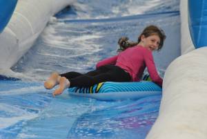 Ilminster Town FC fun day Part 6 – July 9, 2016: A giant water slide was the star attraction at a family fun day held to celebrate Ilminster Town Football Club’s new Archie Gooch Pavilion headquarters in Britten’s Field. Photo 19