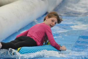 Ilminster Town FC fun day Part 6 – July 9, 2016: A giant water slide was the star attraction at a family fun day held to celebrate Ilminster Town Football Club’s new Archie Gooch Pavilion headquarters in Britten’s Field. Photo 21