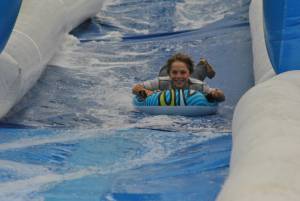 Ilminster Town FC fun day Part 6 – July 9, 2016: A giant water slide was the star attraction at a family fun day held to celebrate Ilminster Town Football Club’s new Archie Gooch Pavilion headquarters in Britten’s Field. Photo 22