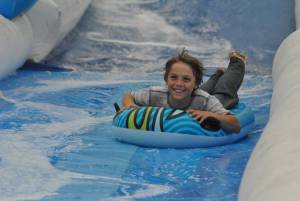 Ilminster Town FC fun day Part 6 – July 9, 2016: A giant water slide was the star attraction at a family fun day held to celebrate Ilminster Town Football Club’s new Archie Gooch Pavilion headquarters in Britten’s Field. Photo 23