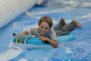 Ilminster Town FC fun day Part 6 – July 9, 2016: A giant water slide was the star attraction at a family fun day held to celebrate Ilminster Town Football Club’s new Archie Gooch Pavilion headquarters in Britten’s Field. Photo 24
