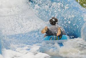 Ilminster Town FC fun day Part 6 – July 9, 2016: A giant water slide was the star attraction at a family fun day held to celebrate Ilminster Town Football Club’s new Archie Gooch Pavilion headquarters in Britten’s Field. Photo 26