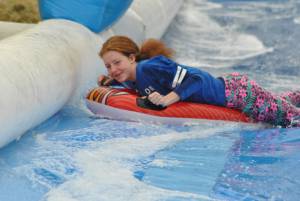 Ilminster Town FC fun day Part 6 – July 9, 2016: A giant water slide was the star attraction at a family fun day held to celebrate Ilminster Town Football Club’s new Archie Gooch Pavilion headquarters in Britten’s Field. Photo 28