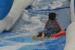 Ilminster Town FC fun day Part 6 – July 9, 2016: A giant water slide was the star attraction at a family fun day held to celebrate Ilminster Town Football Club’s new Archie Gooch Pavilion headquarters in Britten’s Field. Photo 30
