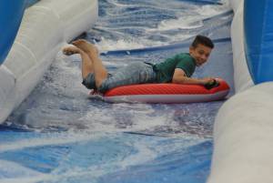 Ilminster Town FC fun day Part 6 – July 9, 2016: A giant water slide was the star attraction at a family fun day held to celebrate Ilminster Town Football Club’s new Archie Gooch Pavilion headquarters in Britten’s Field. Photo 3