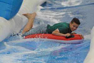 Ilminster Town FC fun day Part 6 – July 9, 2016: A giant water slide was the star attraction at a family fun day held to celebrate Ilminster Town Football Club’s new Archie Gooch Pavilion headquarters in Britten’s Field. Photo 4