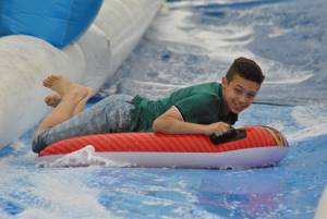 Ilminster Town FC fun day Part 6 – July 9, 2016: A giant water slide was the star attraction at a family fun day held to celebrate Ilminster Town Football Club’s new Archie Gooch Pavilion headquarters in Britten’s Field. Photo 5