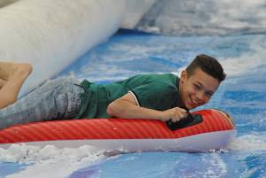 Ilminster Town FC fun day Part 6 – July 9, 2016: A giant water slide was the star attraction at a family fun day held to celebrate Ilminster Town Football Club’s new Archie Gooch Pavilion headquarters in Britten’s Field. Photo 6