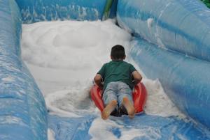 Ilminster Town FC fun day Part 6 – July 9, 2016: A giant water slide was the star attraction at a family fun day held to celebrate Ilminster Town Football Club’s new Archie Gooch Pavilion headquarters in Britten’s Field. Photo 7