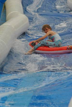 Ilminster Town FC fun day Part 6 – July 9, 2016: A giant water slide was the star attraction at a family fun day held to celebrate Ilminster Town Football Club’s new Archie Gooch Pavilion headquarters in Britten’s Field. Photo 9