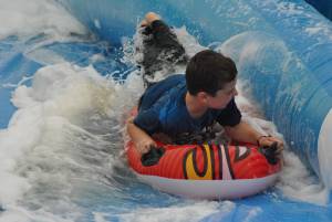 Ilminster Town FC fun day Part 7 – July 9, 2016: A giant water slide was the star attraction at a family fun day held to celebrate Ilminster Town Football Club’s new Archie Gooch Pavilion headquarters in Britten’s Field. Photo 11