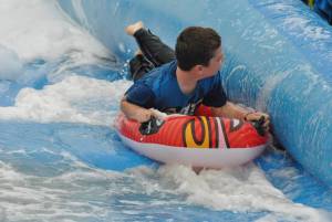 Ilminster Town FC fun day Part 7 – July 9, 2016: A giant water slide was the star attraction at a family fun day held to celebrate Ilminster Town Football Club’s new Archie Gooch Pavilion headquarters in Britten’s Field. Photo 12