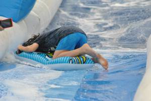 Ilminster Town FC fun day Part 7 – July 9, 2016: A giant water slide was the star attraction at a family fun day held to celebrate Ilminster Town Football Club’s new Archie Gooch Pavilion headquarters in Britten’s Field. Photo 14